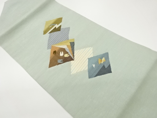 Nagoya obi woven with diamonds, horizontal stripes, and abstract pattern